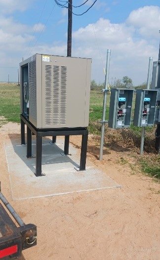 SCI Electrical standby generator installed on a concrete pad with disconnects in a South Texas field